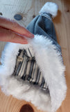 Gray fleece stocking cap with faux fur trim